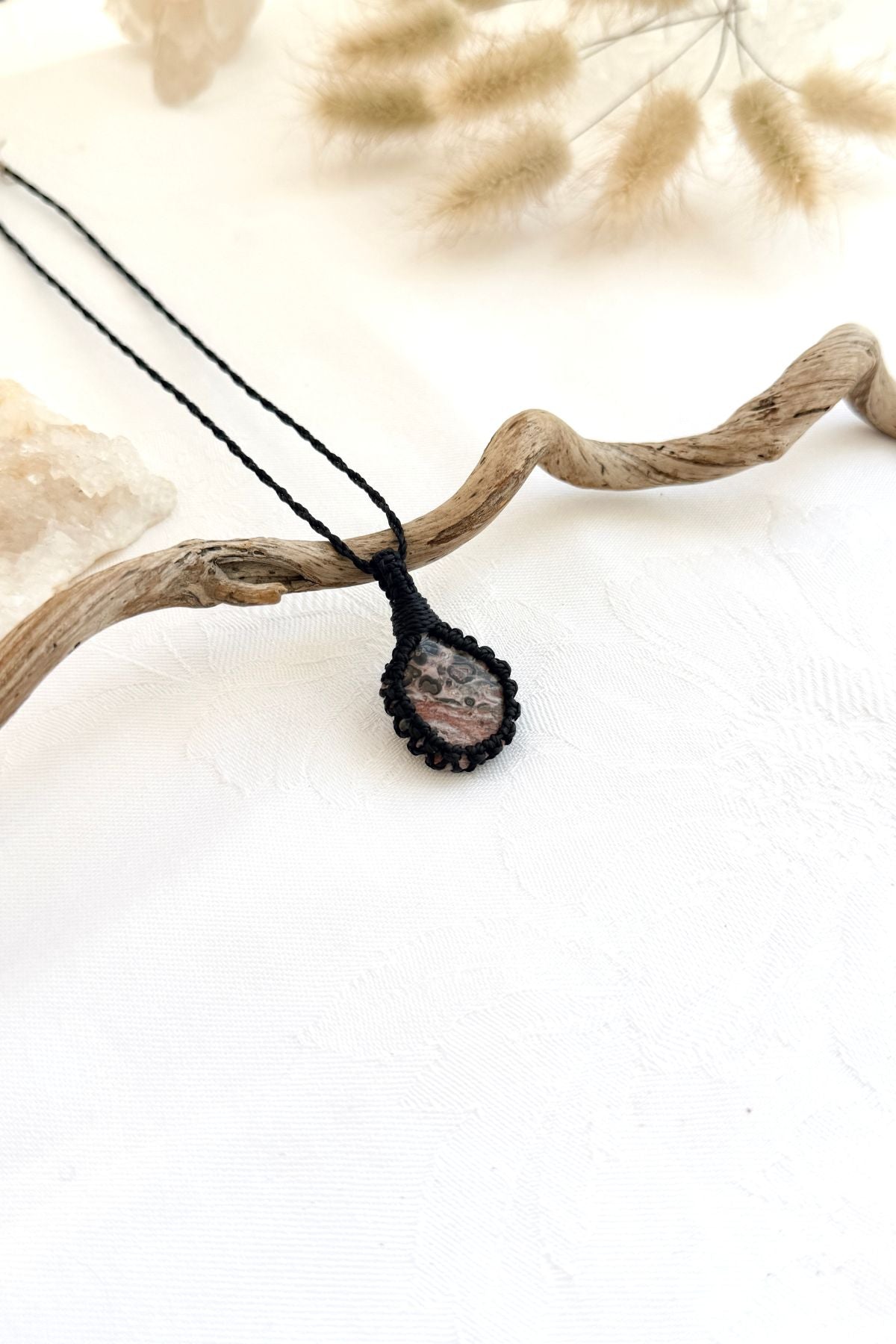 Handmade Leopard Jasper macramé necklace, side view showing the gemstone and macramé knotting
