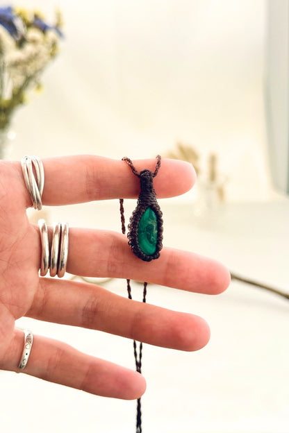 Handmade Malachite macramé necklace held in hand, delicate natural gemstone jewelry