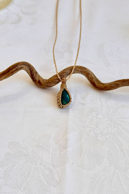 Handmade Malachite Macrame necklace featuring a high-quality gemstone, laid flat to showcase its delicate everyday-wear design from the Essence collection.