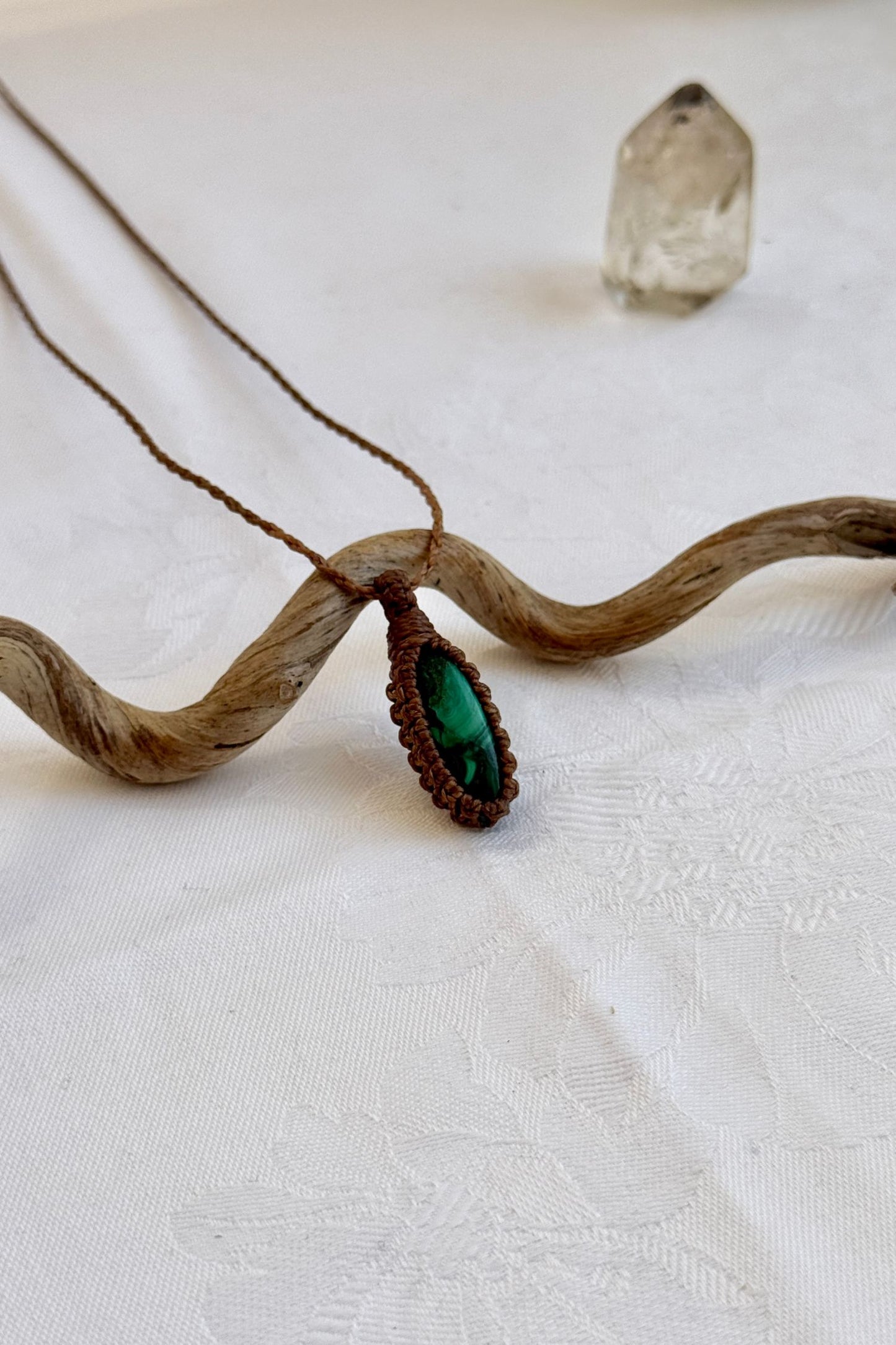 Another side angle shot of the handmade Malachite Macrame necklace, emphasizing the elegant craftsmanship and natural gemstone colors.