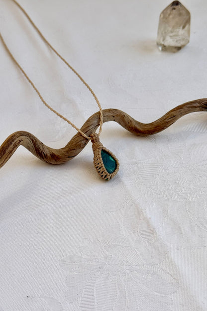 Another side angle shot of the handmade Malachite Macrame necklace, emphasizing the elegant craftsmanship and natural gemstone colors.