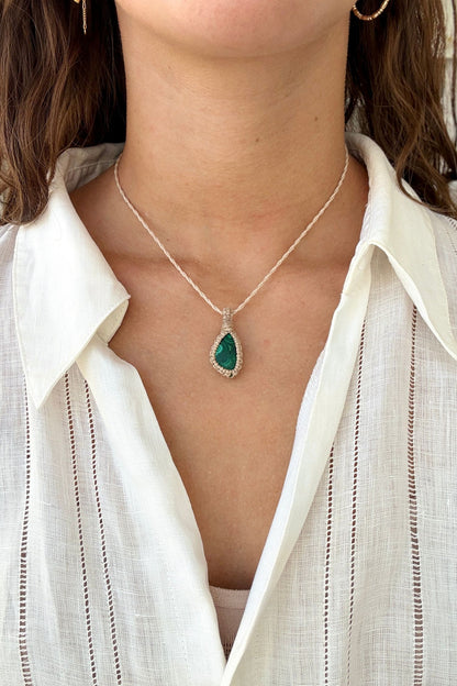 Model wearing a delicate handmade Malachite macrame necklace with a beige cord, perfect for everyday wear.