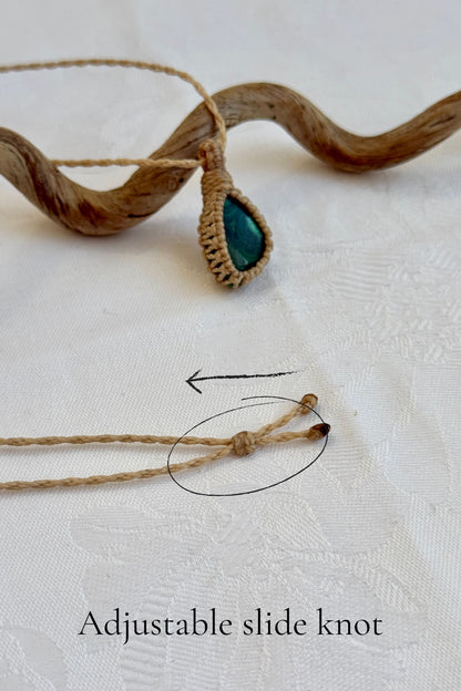 Close-up of the adjustable sliding knot on the Malachite Macrame necklace, allowing for an easy and customizable fit for any wearer.