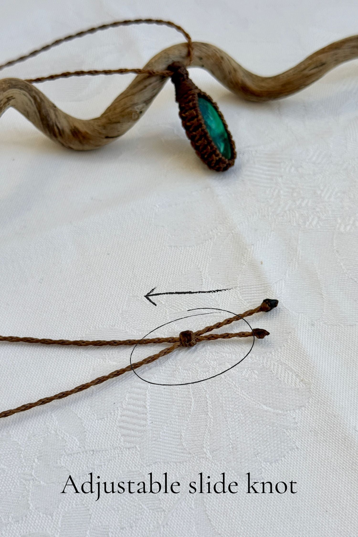 Close-up of the adjustable sliding knot on the Malachite Macrame necklace, allowing for an easy and customizable fit for any wearer.