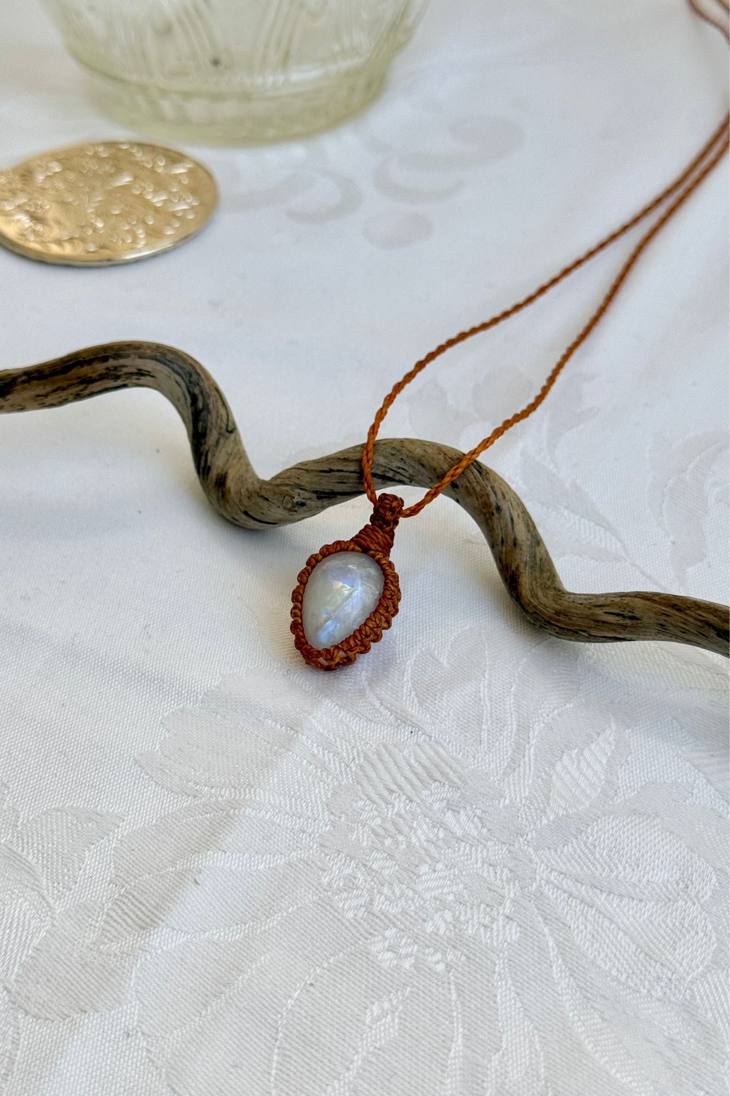 Another side angle shot of the handmade Moonstone Macrame necklace, emphasizing the elegant craftsmanship and natural gemstone colors.