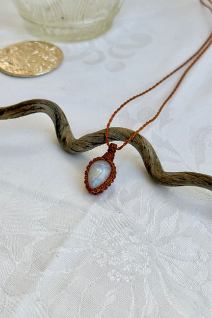 Another side angle shot of the handmade Moonstone Macrame necklace, emphasizing the elegant craftsmanship and natural gemstone colors.