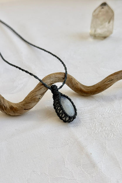 Another side angle shot of the handmade Moonstone Macrame necklace, emphasizing the elegant craftsmanship and natural gemstone colors.