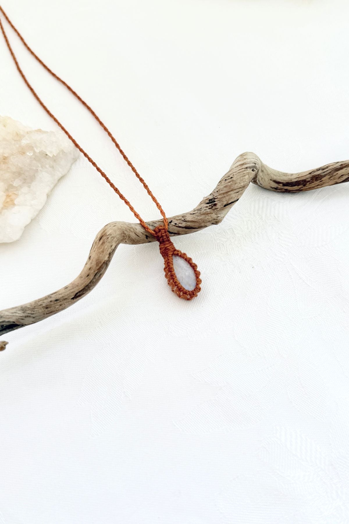 Handmade Moonstone macramé necklace, side view showing the gemstone and macramé knotting