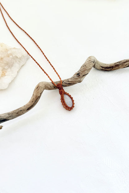 Handmade Moonstone macramé necklace, side view showing the gemstone and macramé knotting