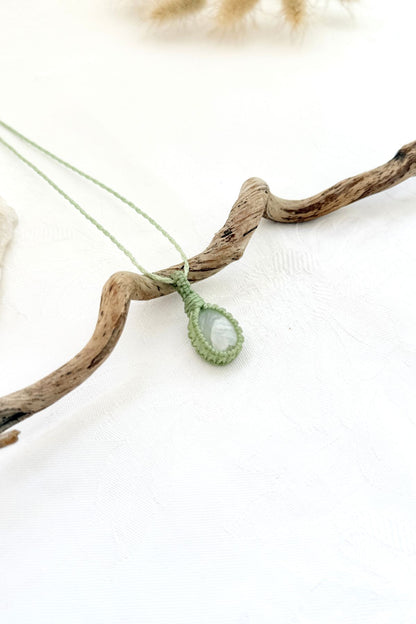 Handmade Moonstone macramé necklace, side view showing the gemstone and macramé knotting