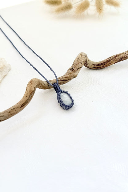 Handmade Moonstone macramé necklace, side view showing the gemstone and macramé knotting
