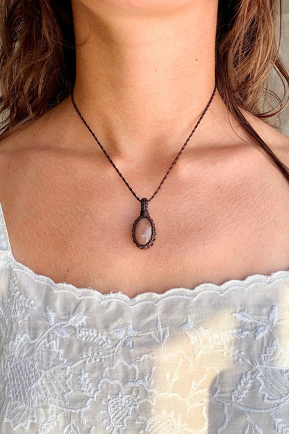 Model wearing a handmade Peach Moonstone macramé necklace, delicate everyday jewelry