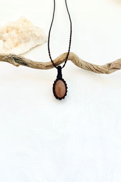 Handmade Peach Moonstone macramé necklace, front view of natural gemstone pendant