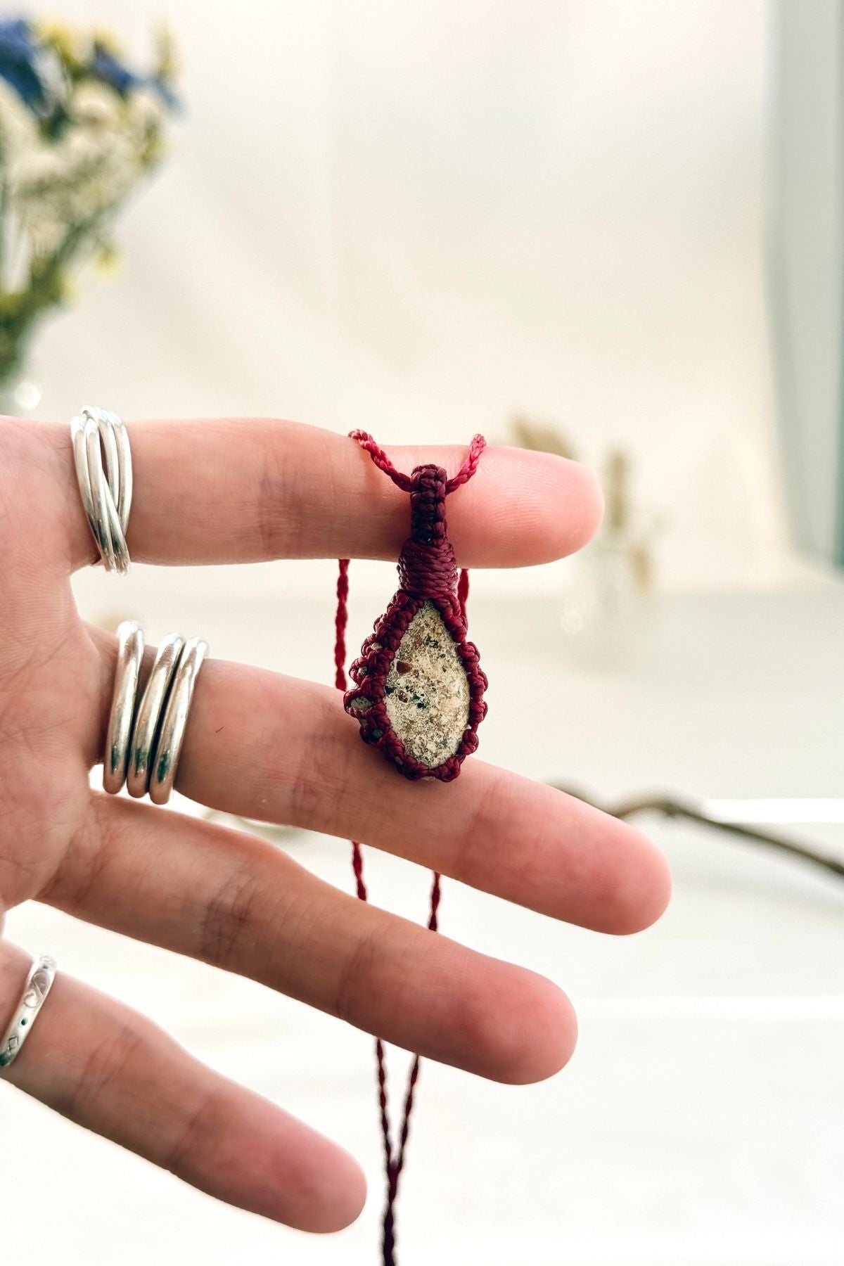 Handmade Picture Jasper macramé necklace held in hand, delicate natural gemstone jewelry