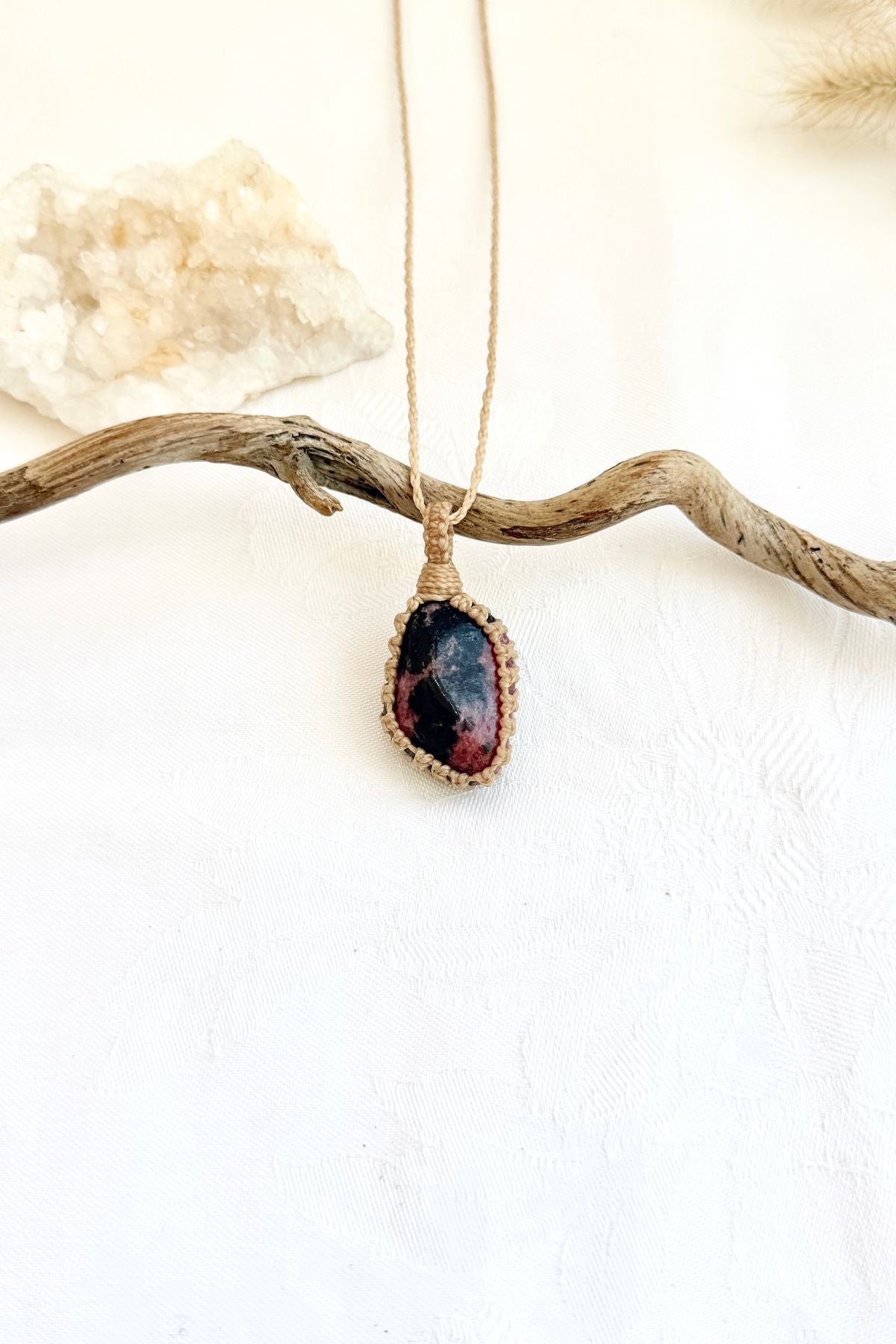 Handmade Rhodonite macramé necklace, front view of natural gemstone pendant