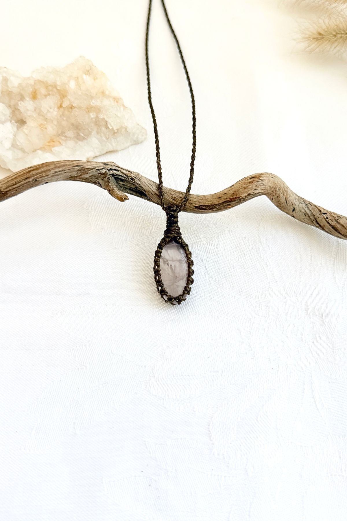 Handmade Rose Quartz macramé necklace, front view of natural gemstone pendant