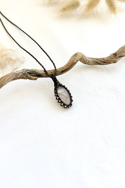 Handmade Rose Quartz macramé necklace, side view showing the gemstone and macramé knotting