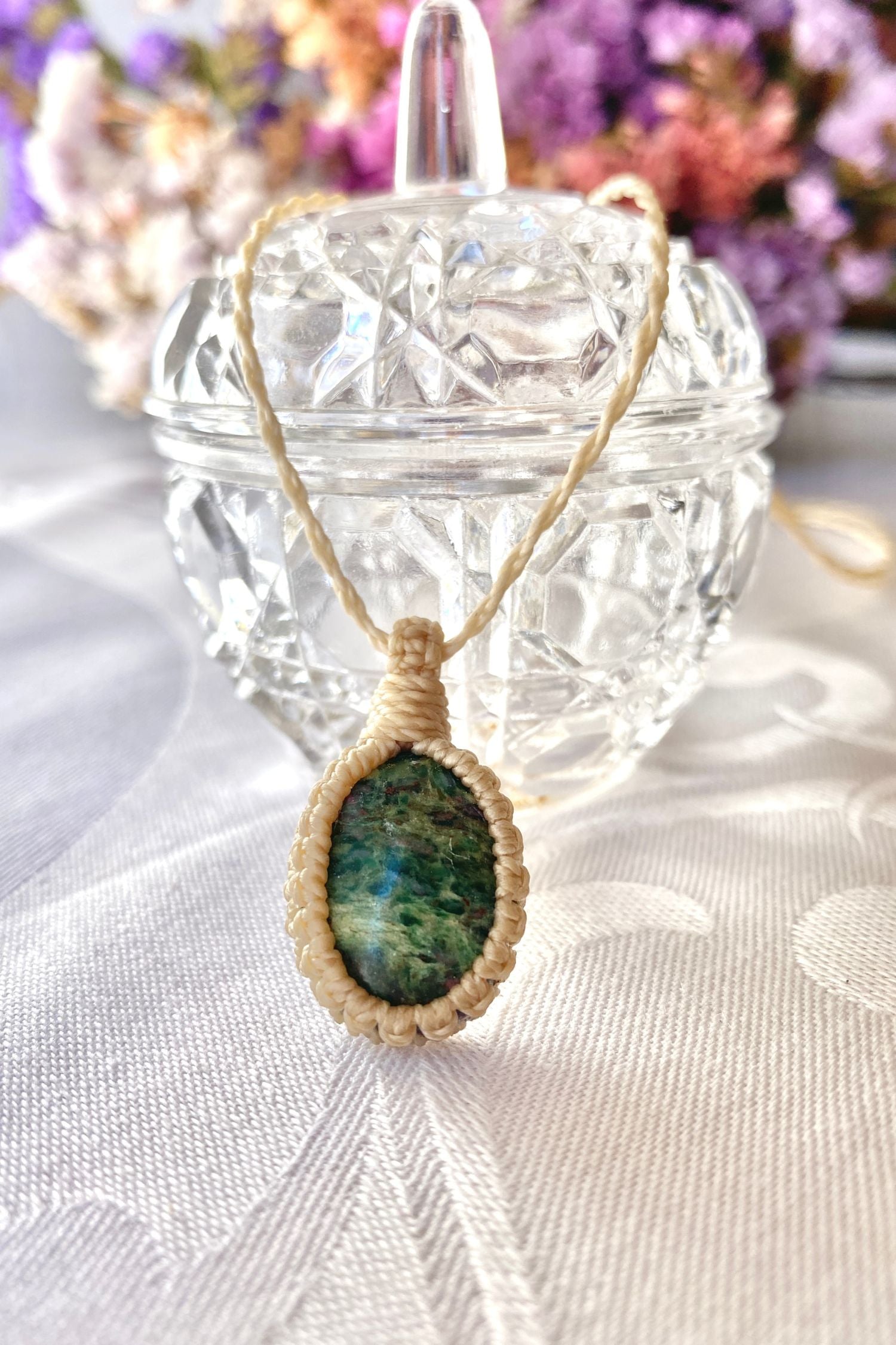 Handmade Ruby Fuchsite Macrame necklace displayed standing, highlighting the minimalist macrame design and the natural beauty of the natural gemstone.