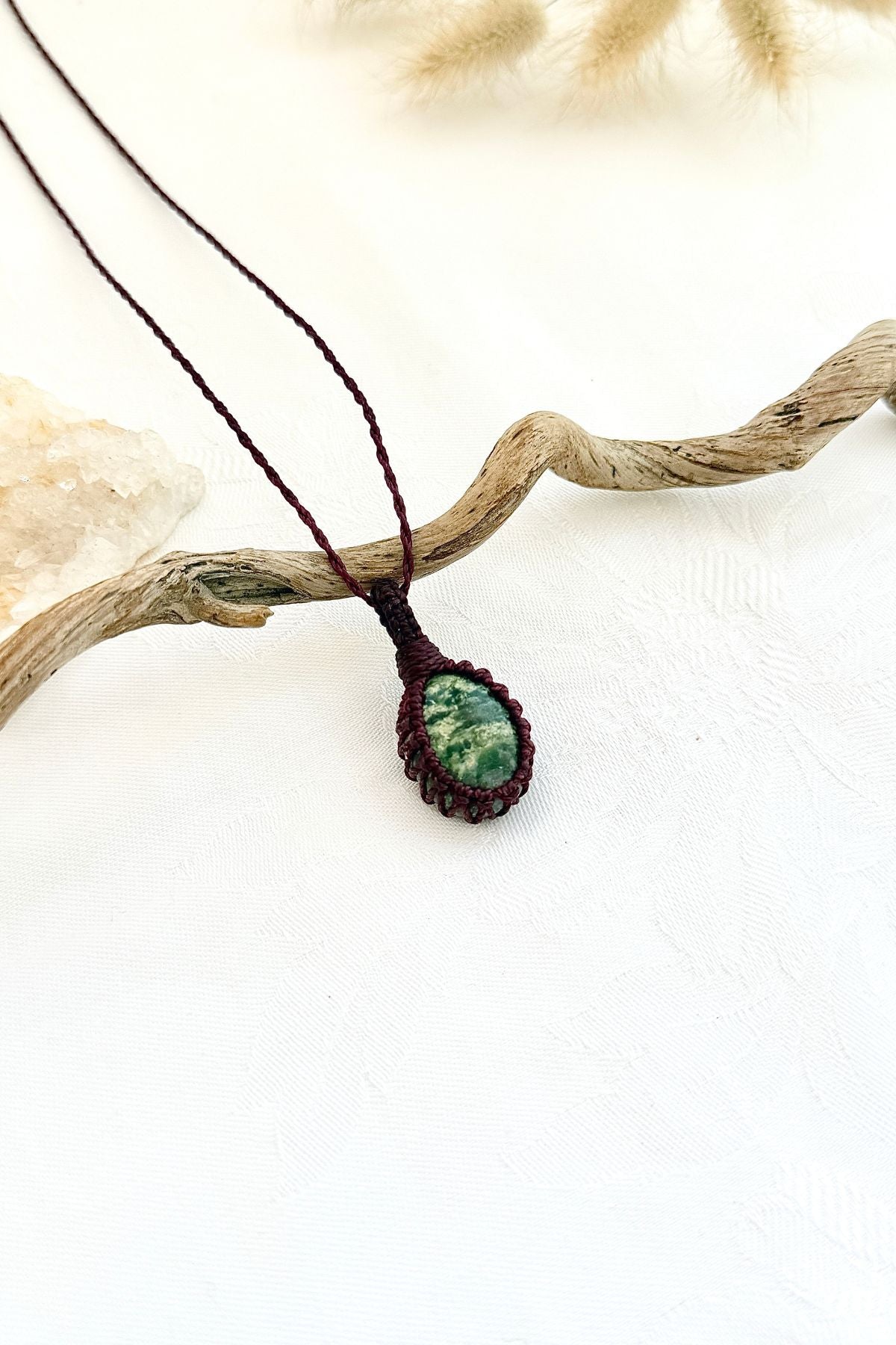 Handmade Ruby Fuchsite macramé necklace, side view showing the gemstone and macramé knotting