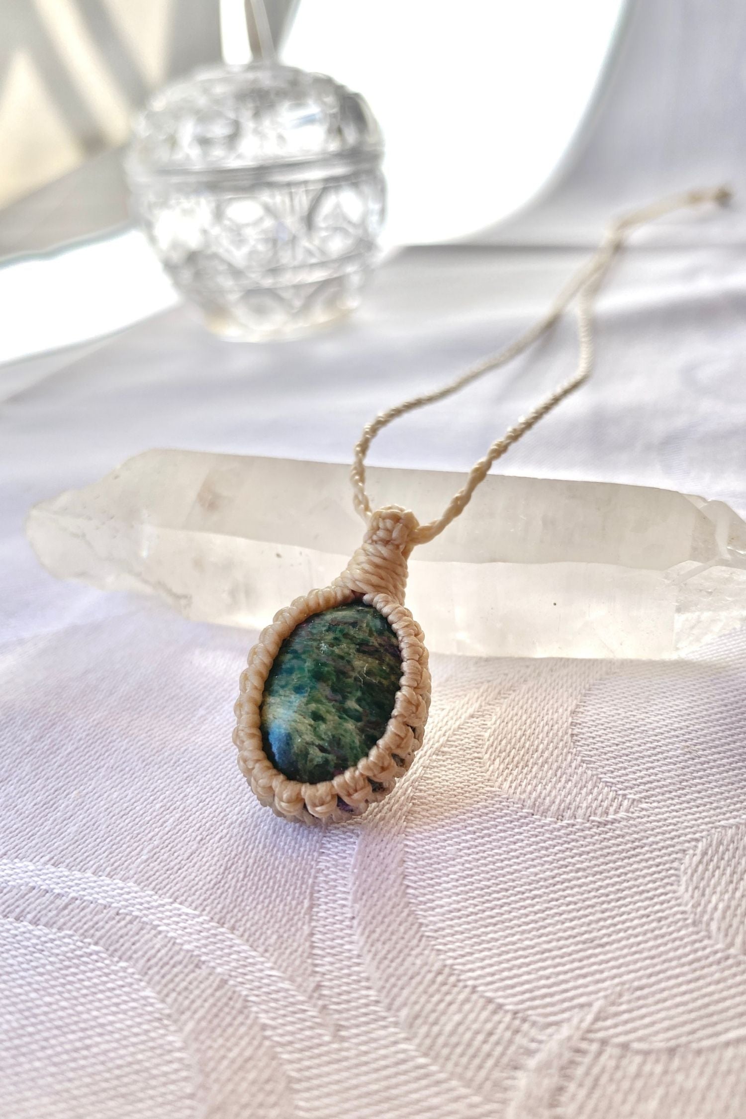 Another side angle shot of the handmade Ruby Fuchsite Macrame necklace, emphasizing the elegant craftsmanship and natural gemstone colors.