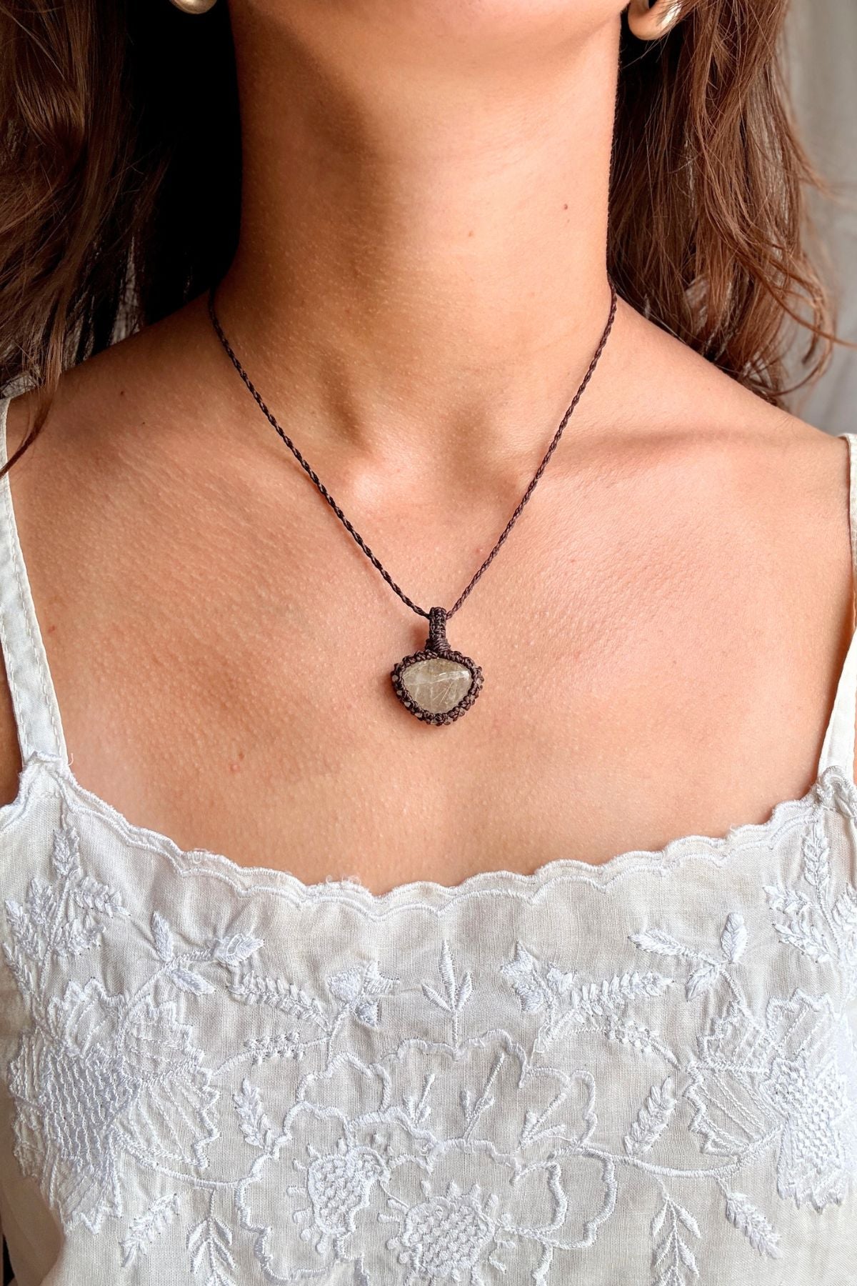 Model wearing a handmade Rutilated Quartz macramé necklace, delicate everyday jewelry