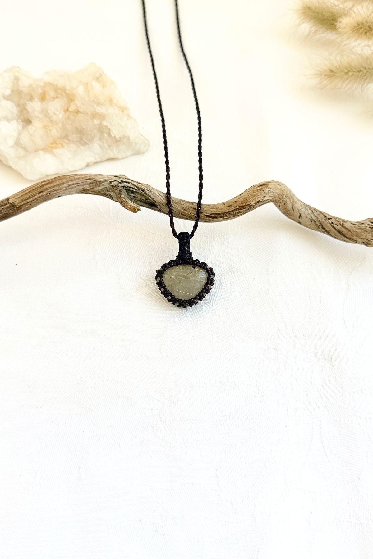 Handmade Rutilated Quartz macramé necklace, front view of natural gemstone pendant