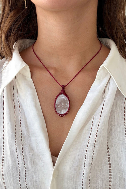 Model wearing a delicate handmade Selenite macrame necklace with a red cord, perfect for everyday wear.
