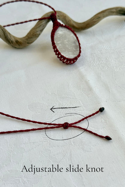 Close-up of the adjustable sliding knot on the Selenite Macrame necklace, allowing for an easy and customizable fit for any wearer.