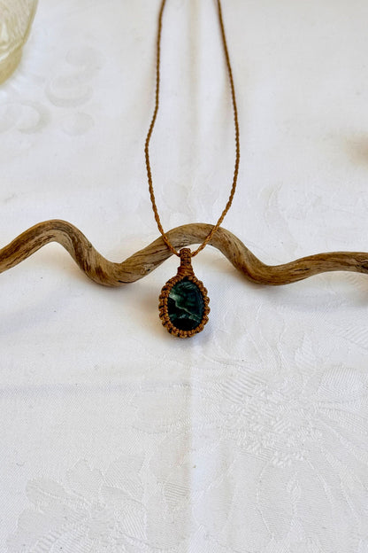 Handmade Seraphinite Macrame necklace featuring a high-quality gemstone, laid flat to showcase its delicate everyday-wear design from the Essence collection.