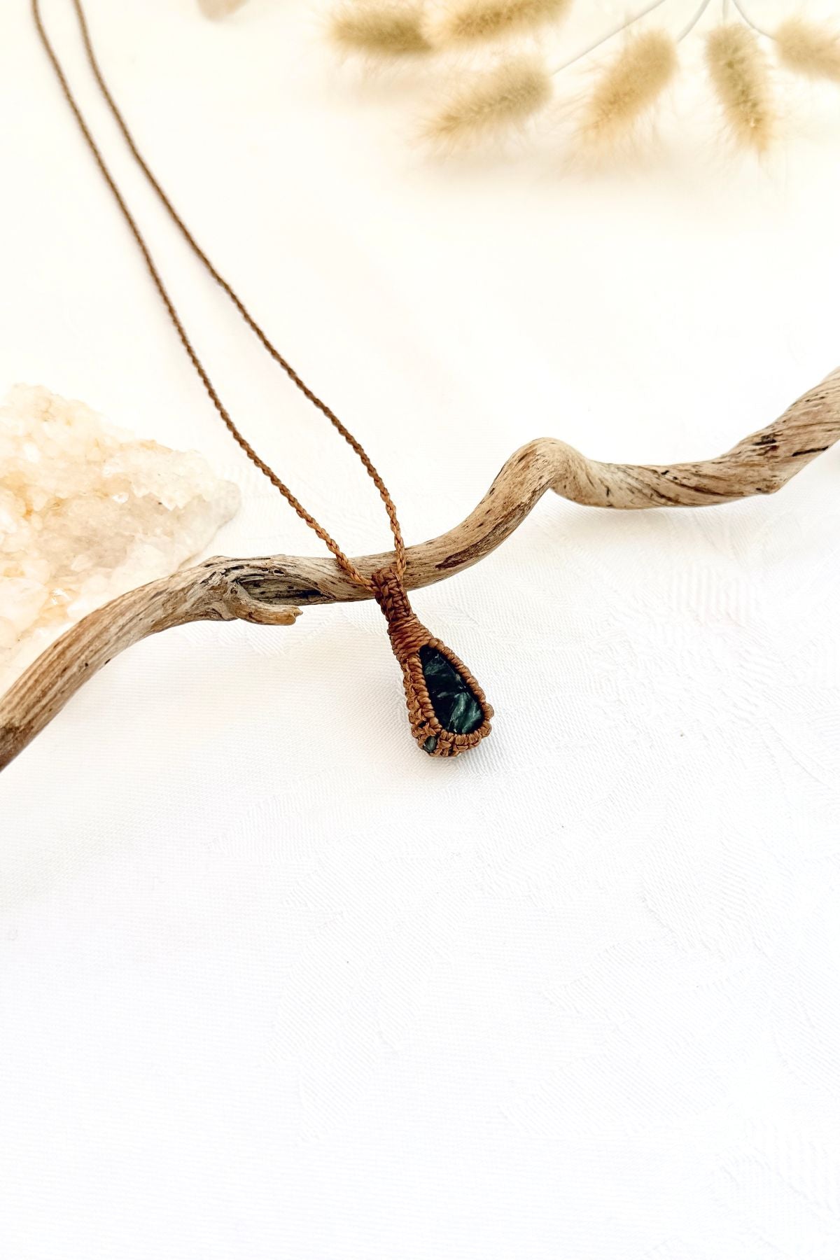 Handmade Seraphinite macramé necklace, side view showing the gemstone and macramé knotting