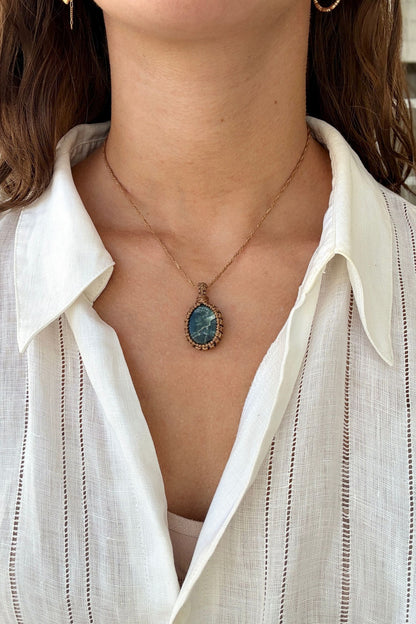 Model wearing a delicate handmade Seraphinite macrame necklace with a gold brown cord, perfect for everyday wear.