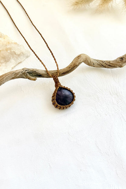 Handmade Star Amethyst macramé necklace, side view showing the gemstone and macramé knotting