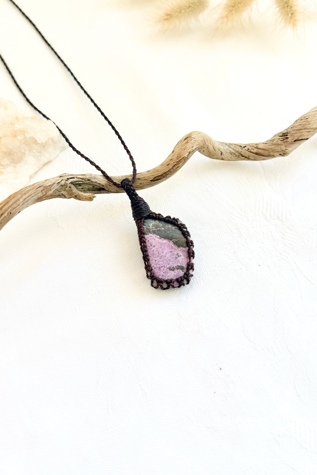 Handmade Stichtite macramé necklace, side view showing the gemstone and macramé knotting