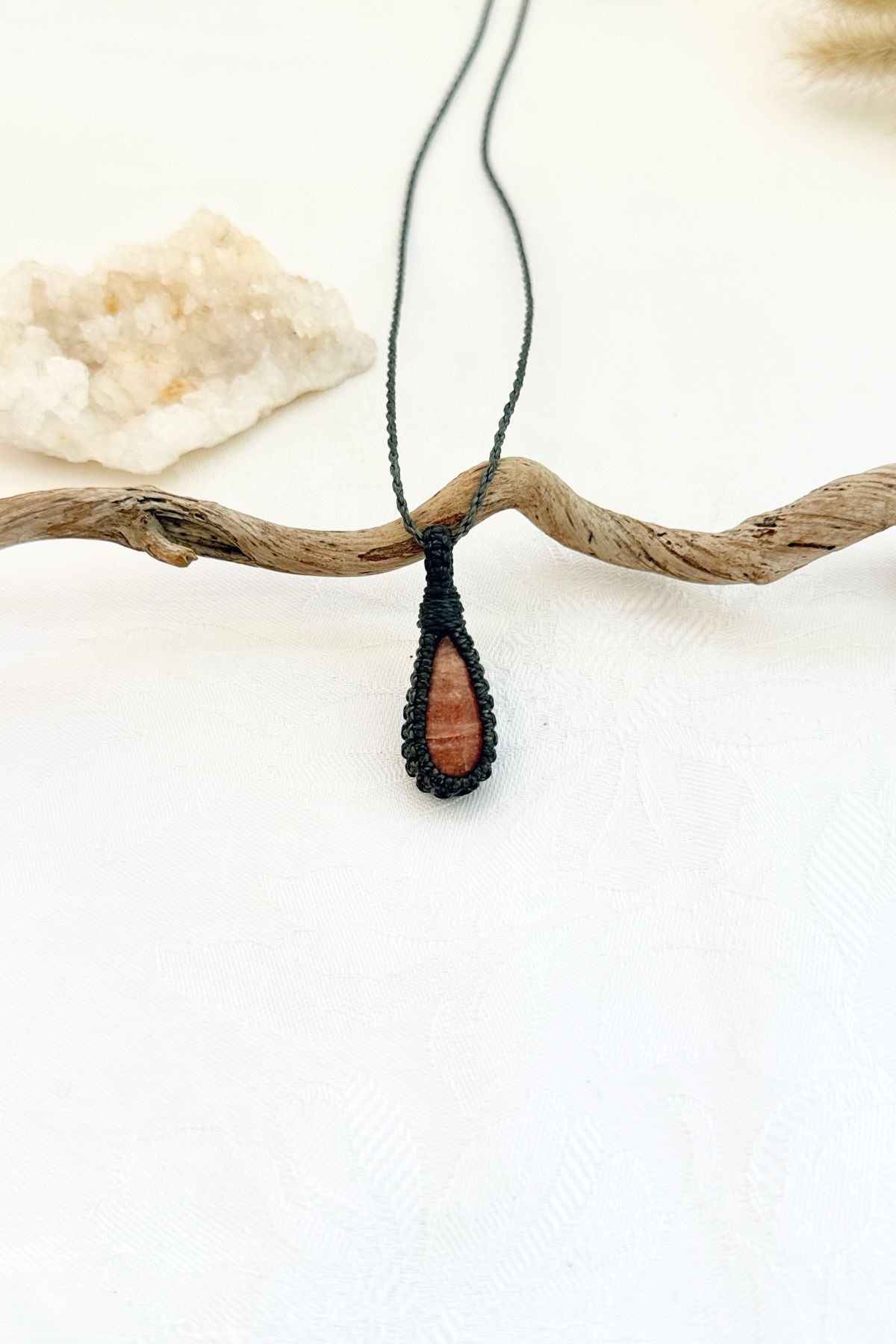 Handmade Sunstone macramé necklace, front view of natural gemstone pendant