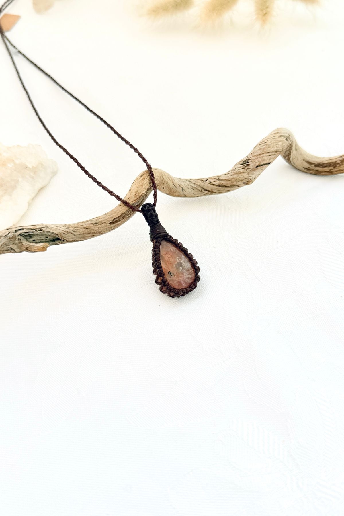 Handmade Sunstone macramé necklace, side view showing the gemstone and macramé knotting