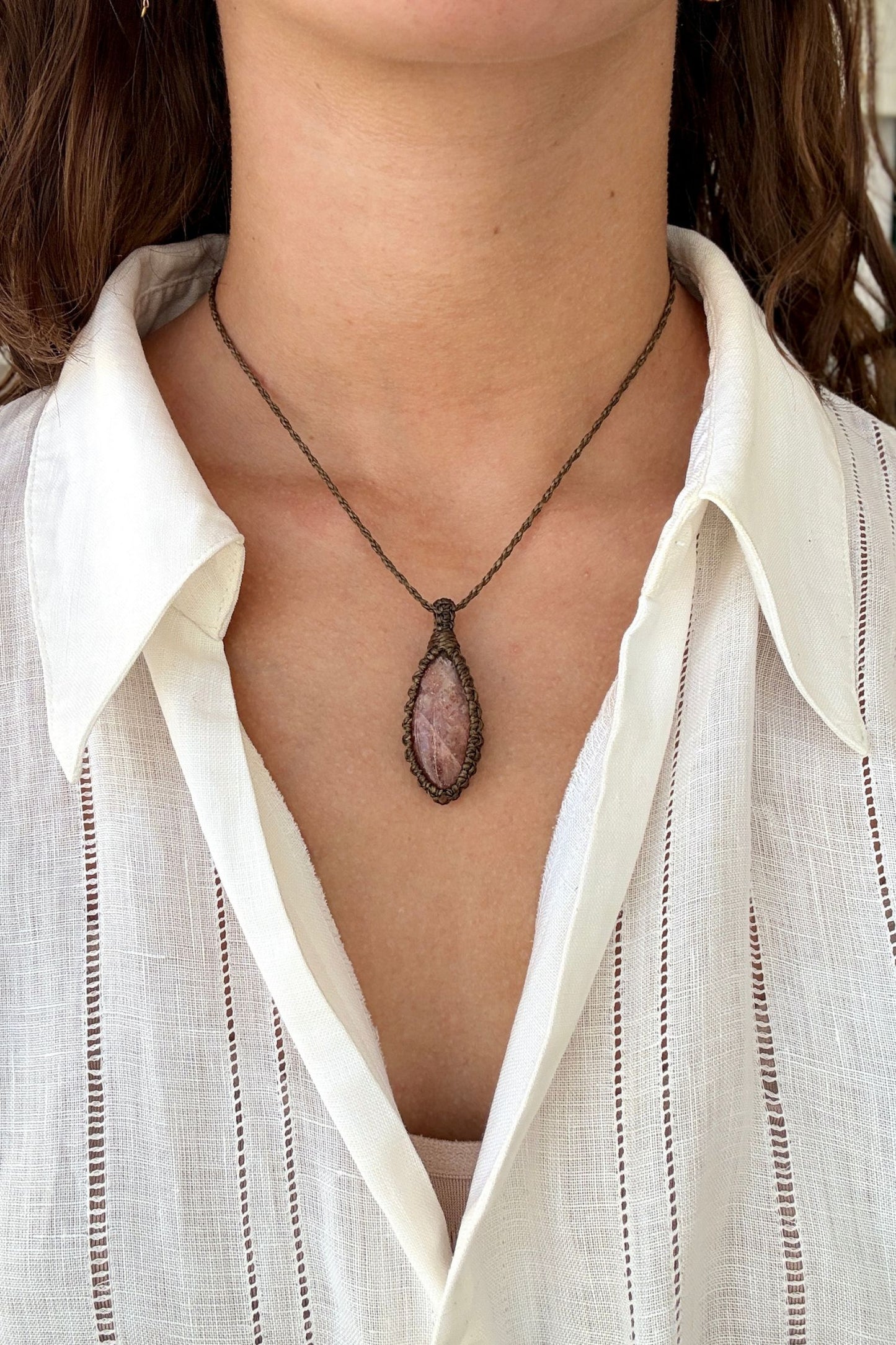Model wearing a delicate handmade Sunstone macrame necklace with a green cord, perfect for everyday wear.