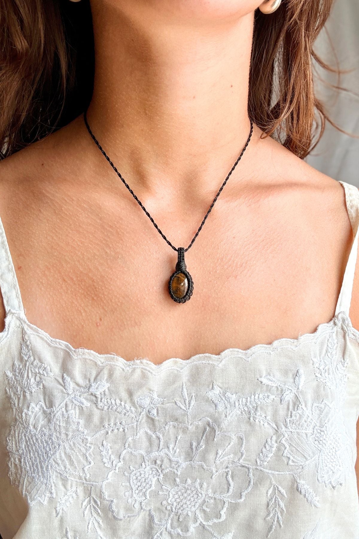 Model wearing a handmade Tiger’s Eye macramé necklace, delicate everyday jewelry