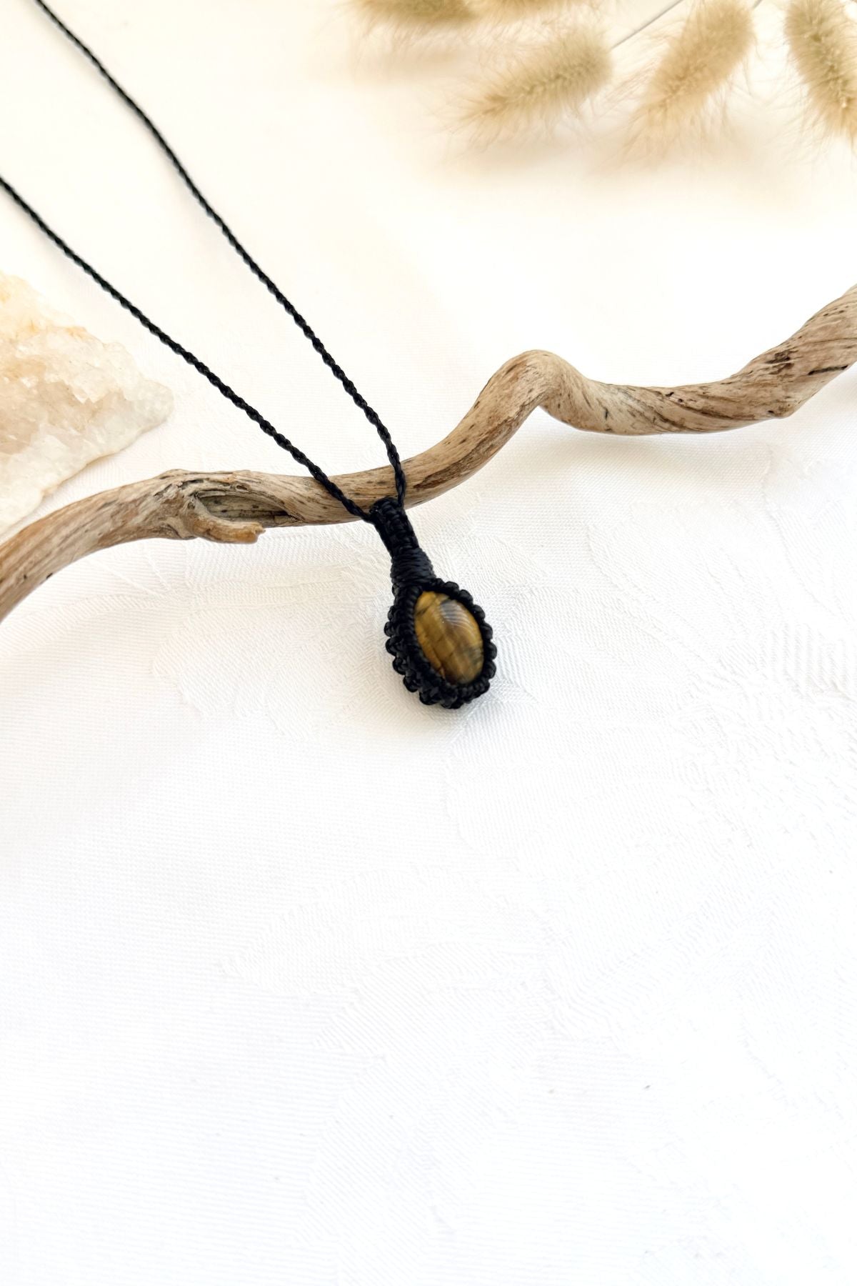 Handmade Tiger’s Eye macramé necklace, side view showing the gemstone and macramé knotting