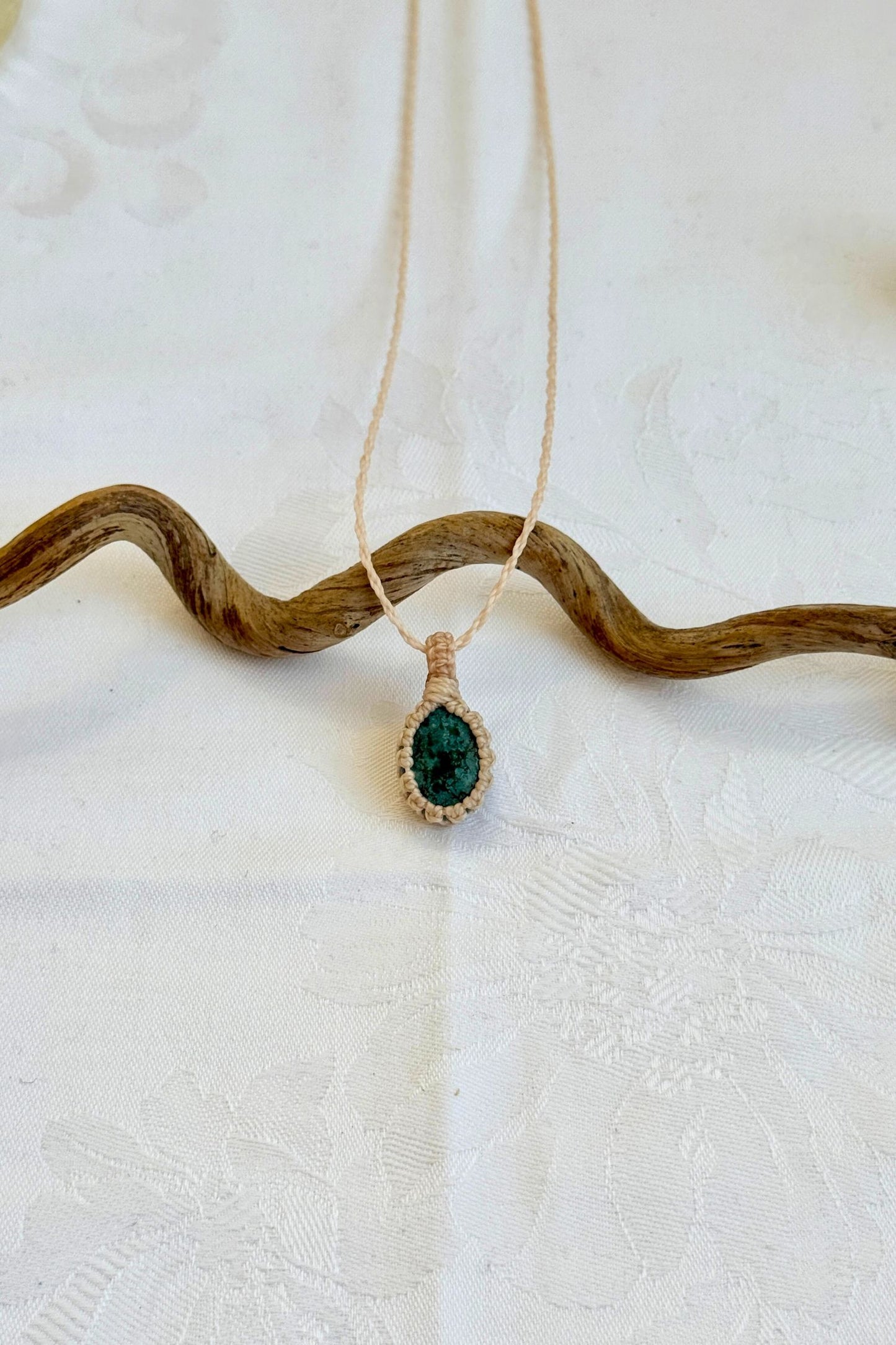 Handmade Turquoise Macrame necklace featuring a high-quality gemstone, laid flat to showcase its delicate everyday-wear design from the Essence collection.