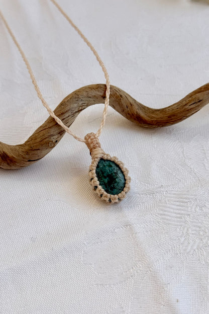 Close-up of handmade Turquoise Macrame necklace, showcasing the intricate macrame knotting and the vibrant patterns of the gemstone.