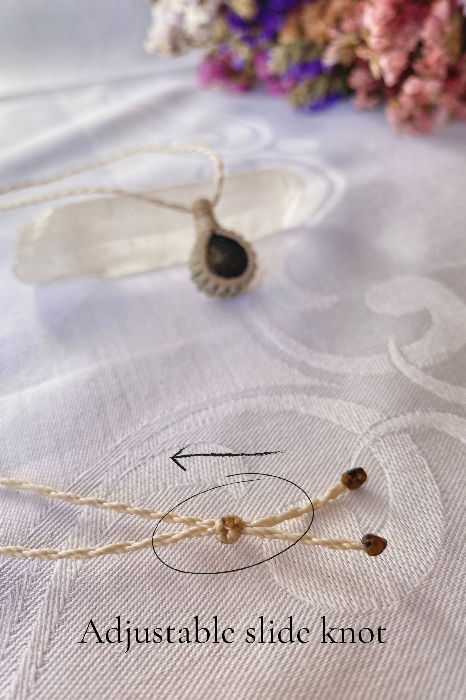 Close-up of the adjustable sliding knot on the Turquoise Macrame necklace, allowing for an easy and customizable fit for any wearer.