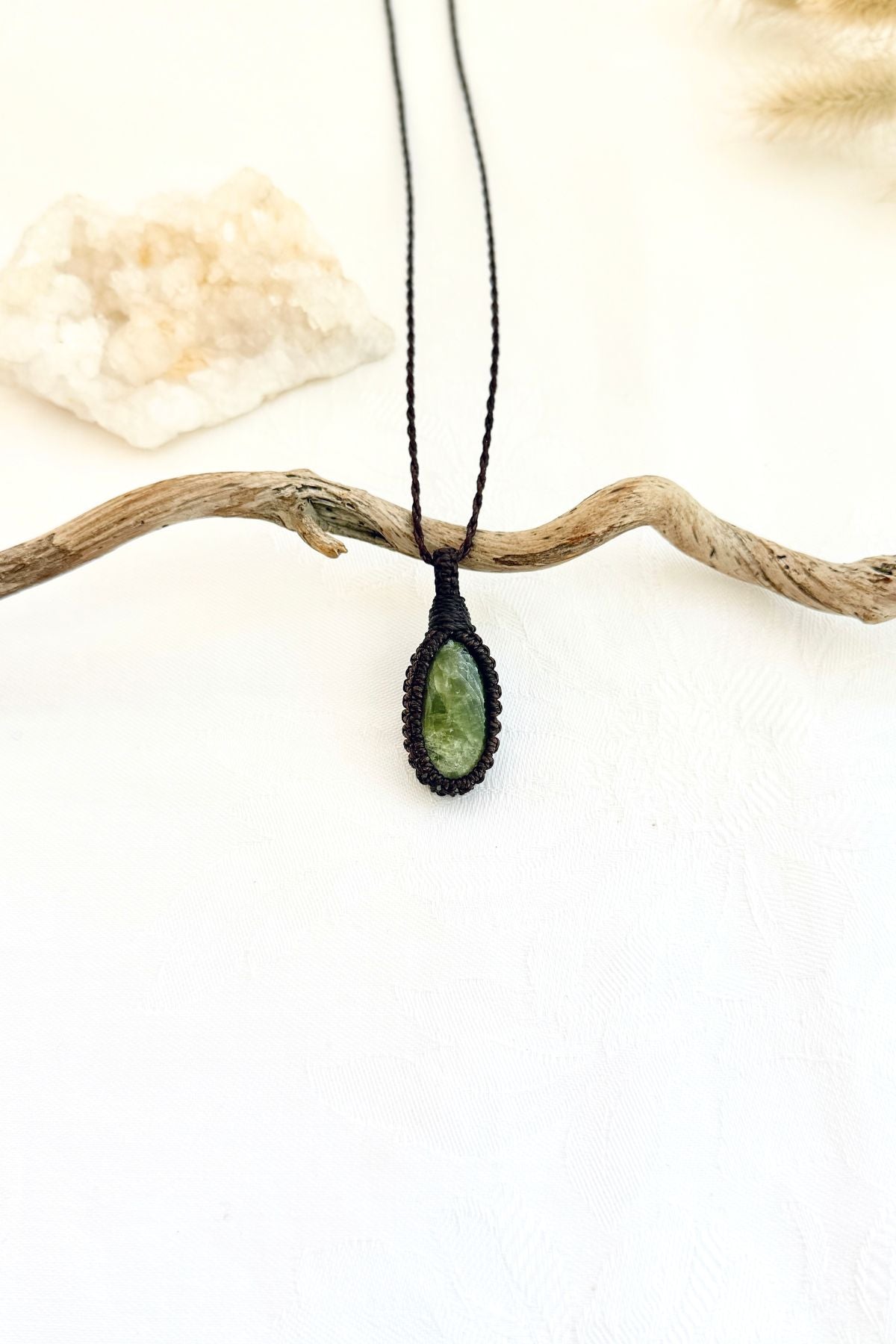 Handmade Vesuvianite macramé necklace, front view of natural gemstone pendant