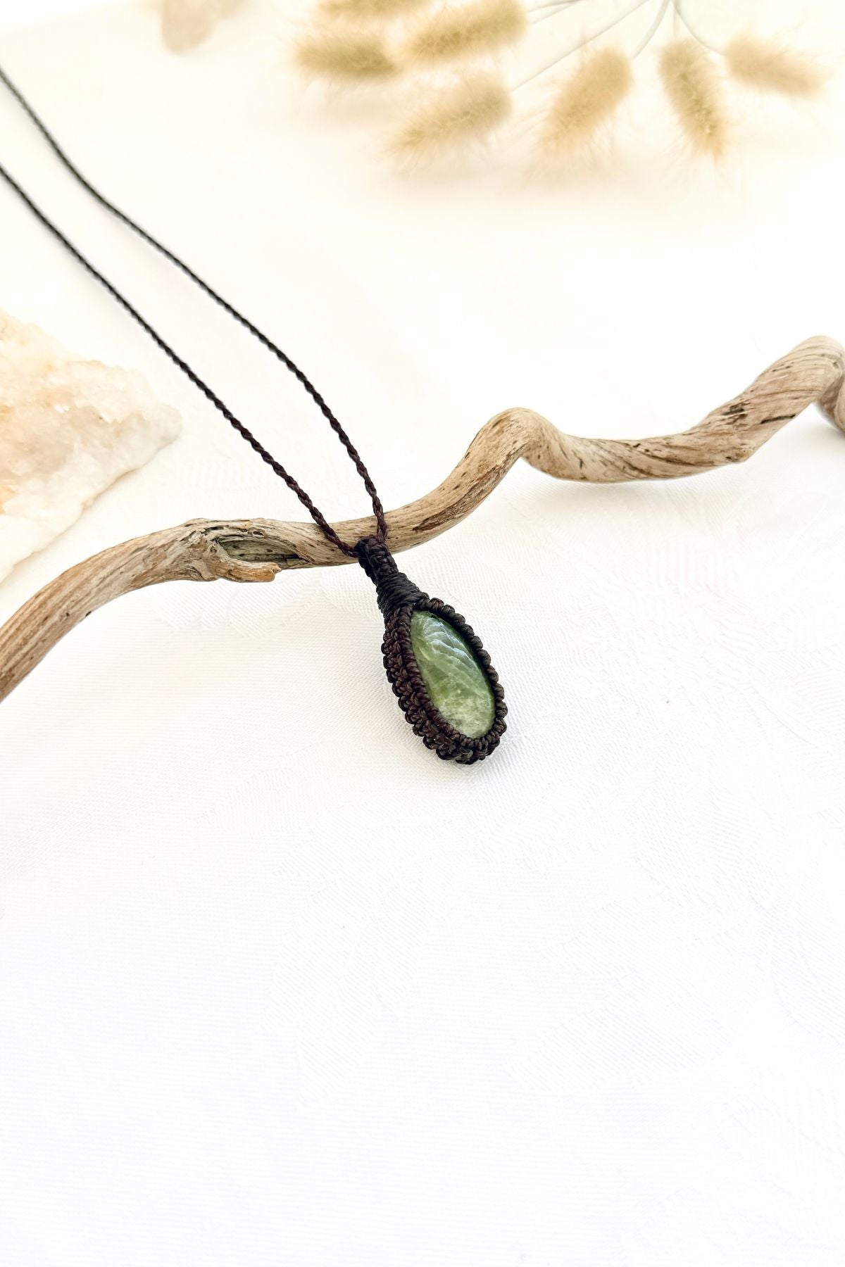 Handmade Vesuvianite macramé necklace, side view showing the gemstone and macramé knotting