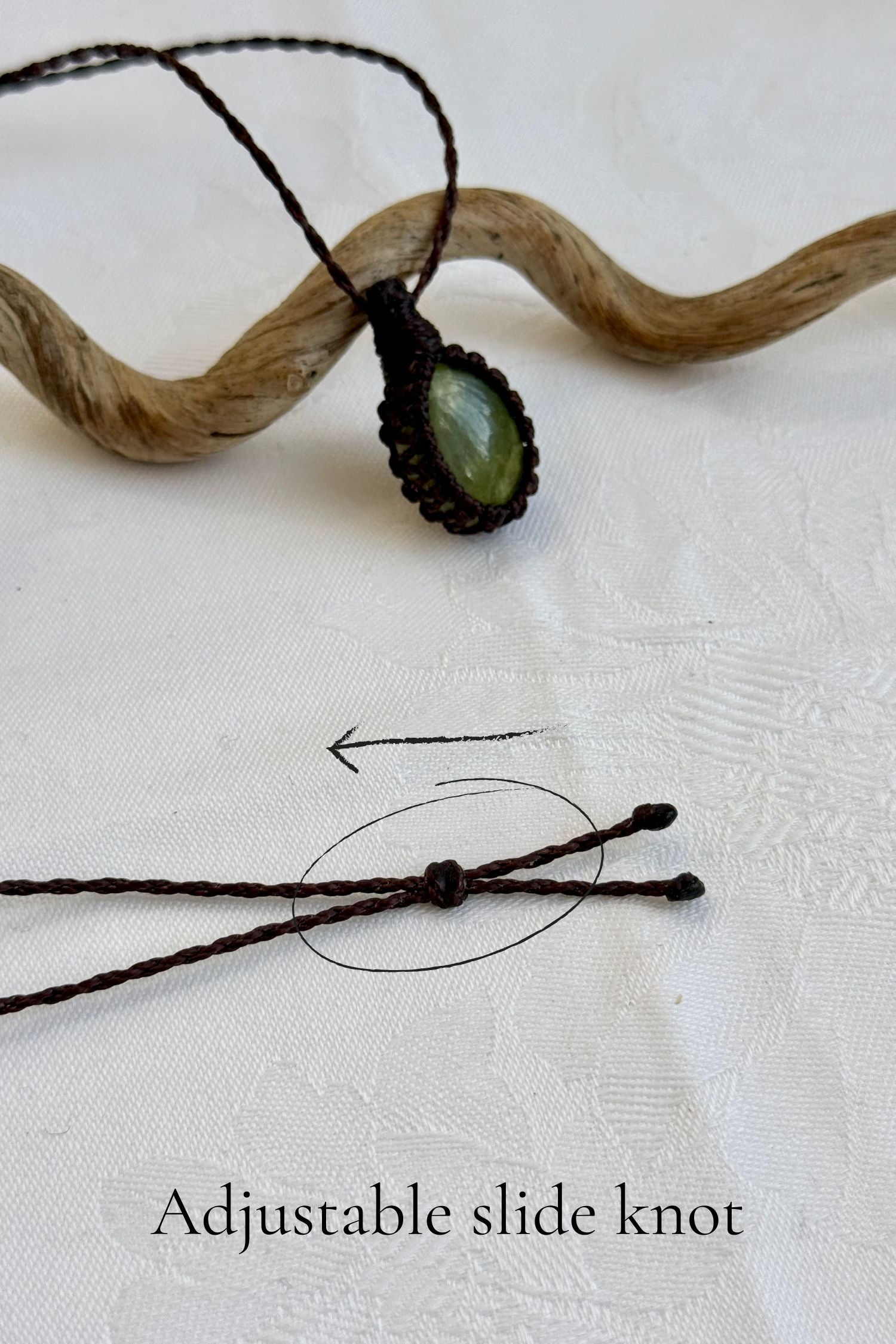Close-up of the adjustable sliding knot on the Vesuvianite Macrame necklace, allowing for an easy and customizable fit for any wearer.