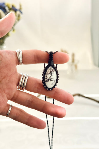 Handmade Wild Horse Magnesite macramé necklace held in hand, delicate natural gemstone jewelry