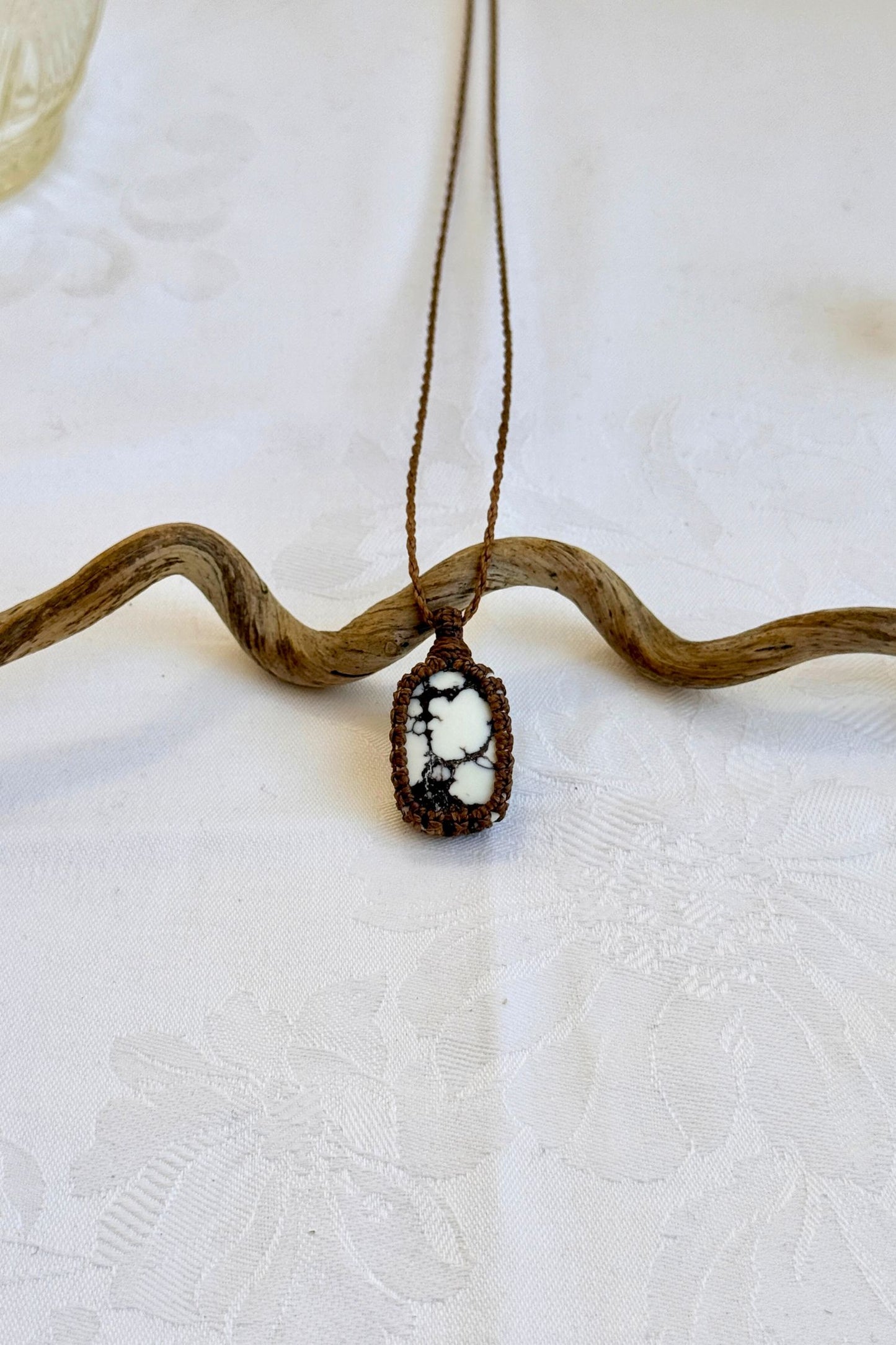 Handmade Wild Horse Magnesite Macrame necklace featuring a high-quality gemstone, laid flat to showcase its delicate everyday-wear design from the Essence collection.