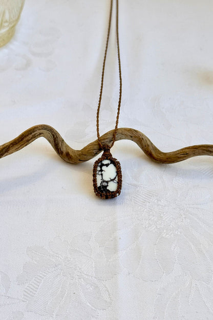 Handmade Wild Horse Magnesite Macrame necklace featuring a high-quality gemstone, laid flat to showcase its delicate everyday-wear design from the Essence collection.