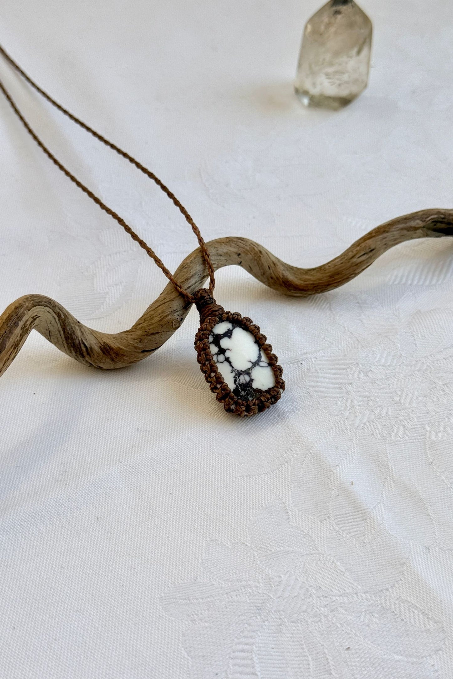 Another side angle shot of the handmade Wild Horse Magnesite Macrame necklace, emphasizing the elegant craftsmanship and natural gemstone colors.