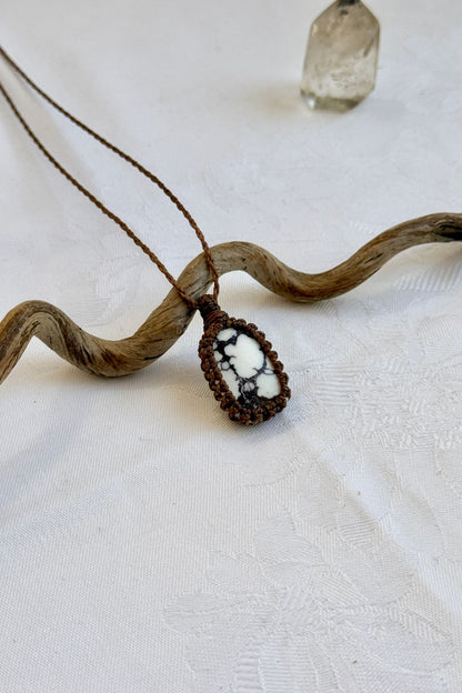 Another side angle shot of the handmade Wild Horse Magnesite Macrame necklace, emphasizing the elegant craftsmanship and natural gemstone colors.