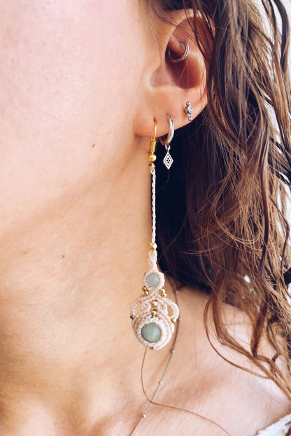 Model wearing handmade macrame earrings featuring amazonite and aquamarine gemstones, showcasing the lightweight, long drop style perfect for any occasion.